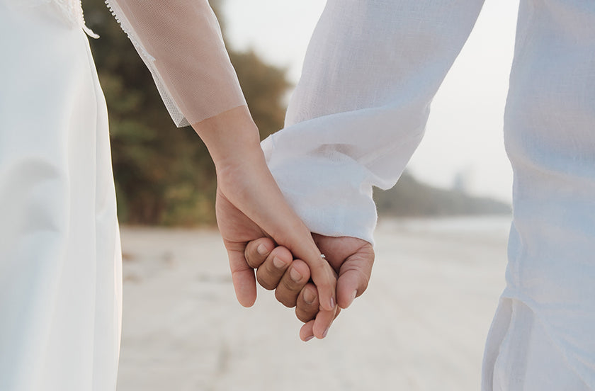 two persons holding hand